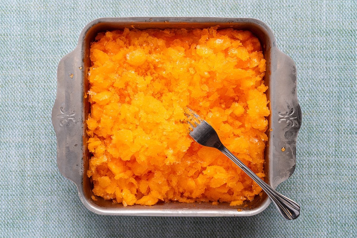 semi-frozen soda with a fork in a container