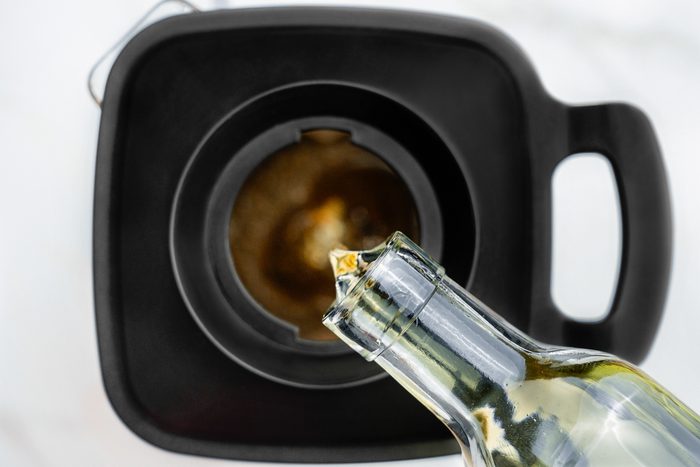 oil being added to blended mixture