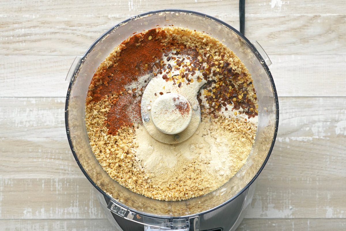 paprika, onion powder, ginger, pepper flakes, cayenne pepper and garlic powder, and pulse added to chopped peanuts