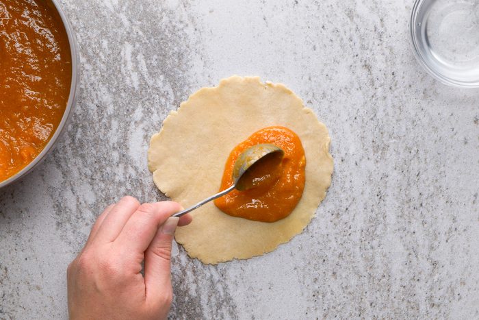 adding filling onto dough circle