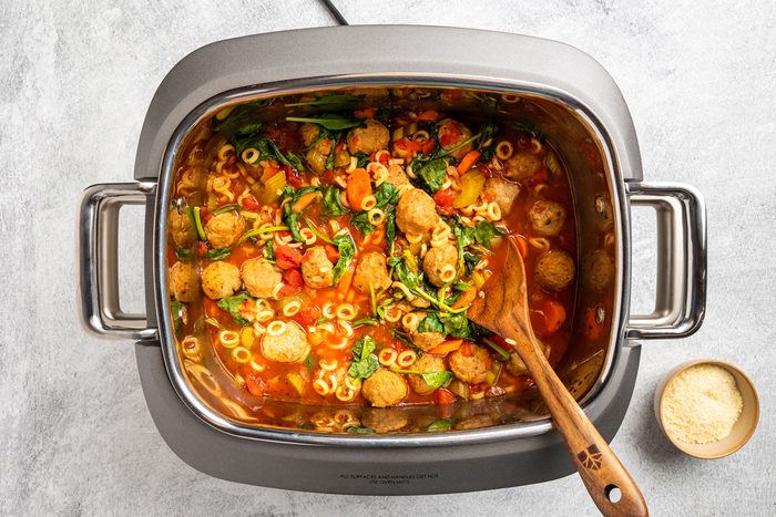pasta and spinach added to meat, vegetables and seasoning mixture