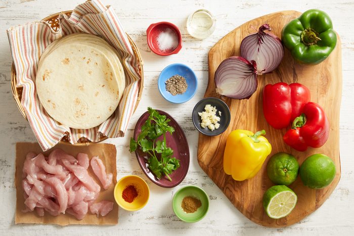 Canola oil, Boneless turkey breast tenderloins, Green, sweet red and yellow peppers, Onion, Minced garlic, Salt, Ground cumin, Pepper, Cayenne pepper, Fresh cilantro, Lime juice, Flour tortillas