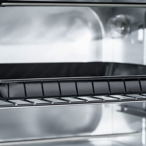 Empty Electric oven view inside. Microwave