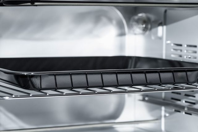 Empty Electric oven view inside. Microwave