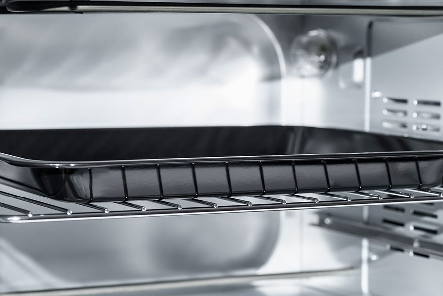 Empty Electric oven view inside. Microwave