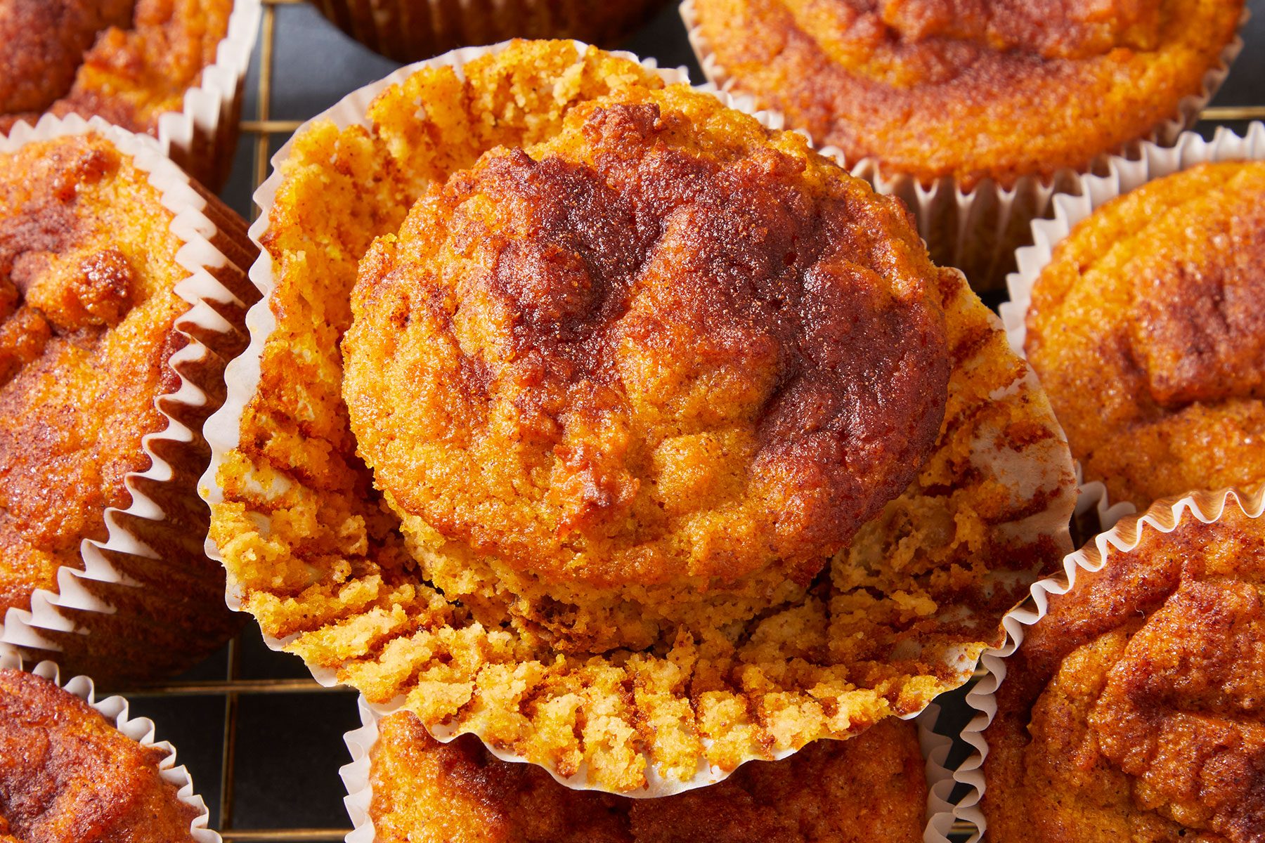 Keto Pumpkin Muffins close up shot on a wire rack.