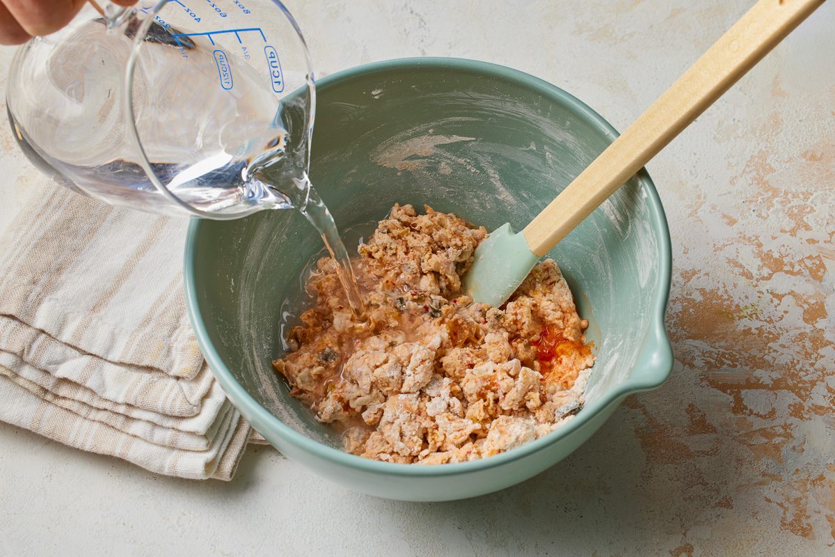 water being added to kimchi and dry ingredients