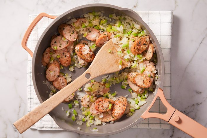Add sausage, onion and celery; cook and stir until sausage is browned,