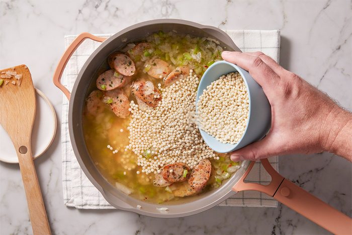 Stir in broth, water and pepper flakes; bring to a boil. Stir in couscous.